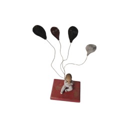 Bronze table on wood - The child with balloons 
