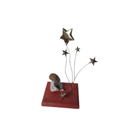 Brass table on wood - child in the stars 